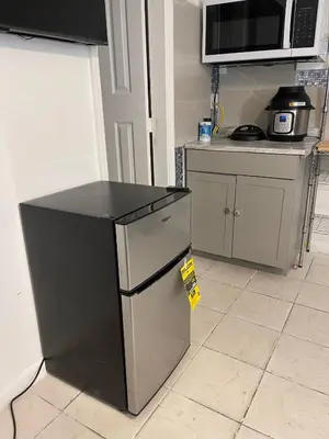 a kitchen with a small refrigerator and a microwave at Best Value inside City Miami, Near Airport, Beach, Center & Metro in Miami