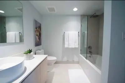 a bathroom with a sink and a toilet and a shower at Scenic Miami Beach Oasis - Full Kitchen -08A in Hallandale Beach