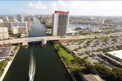 an aerial view of a city with a river and a bridge at Scenic Miami Beach Oasis - Full Kitchen -08A in Hallandale Beach