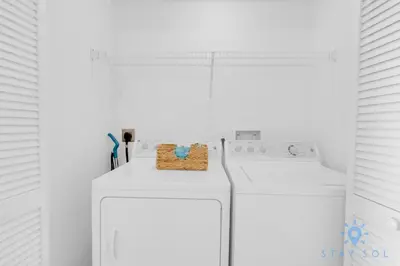 a white washer and dryer in a white room at Pool - Apartment with Balcony - Gym - Near Beach in Hallandale Beach